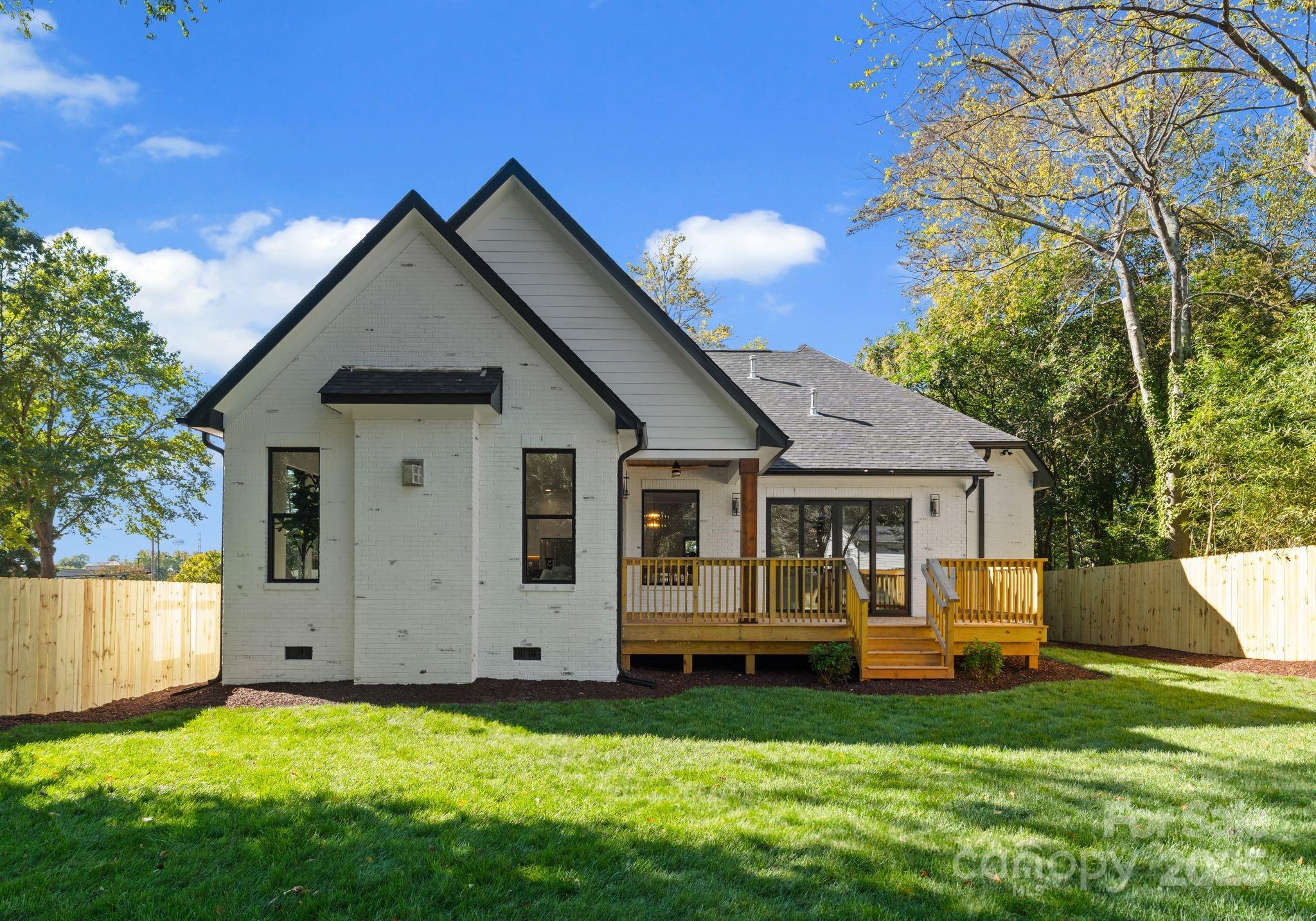 4641 Connecting Road Charlotte, NC 28209 - Photo 41 of 48 a front view of house with yard and trees in the background
