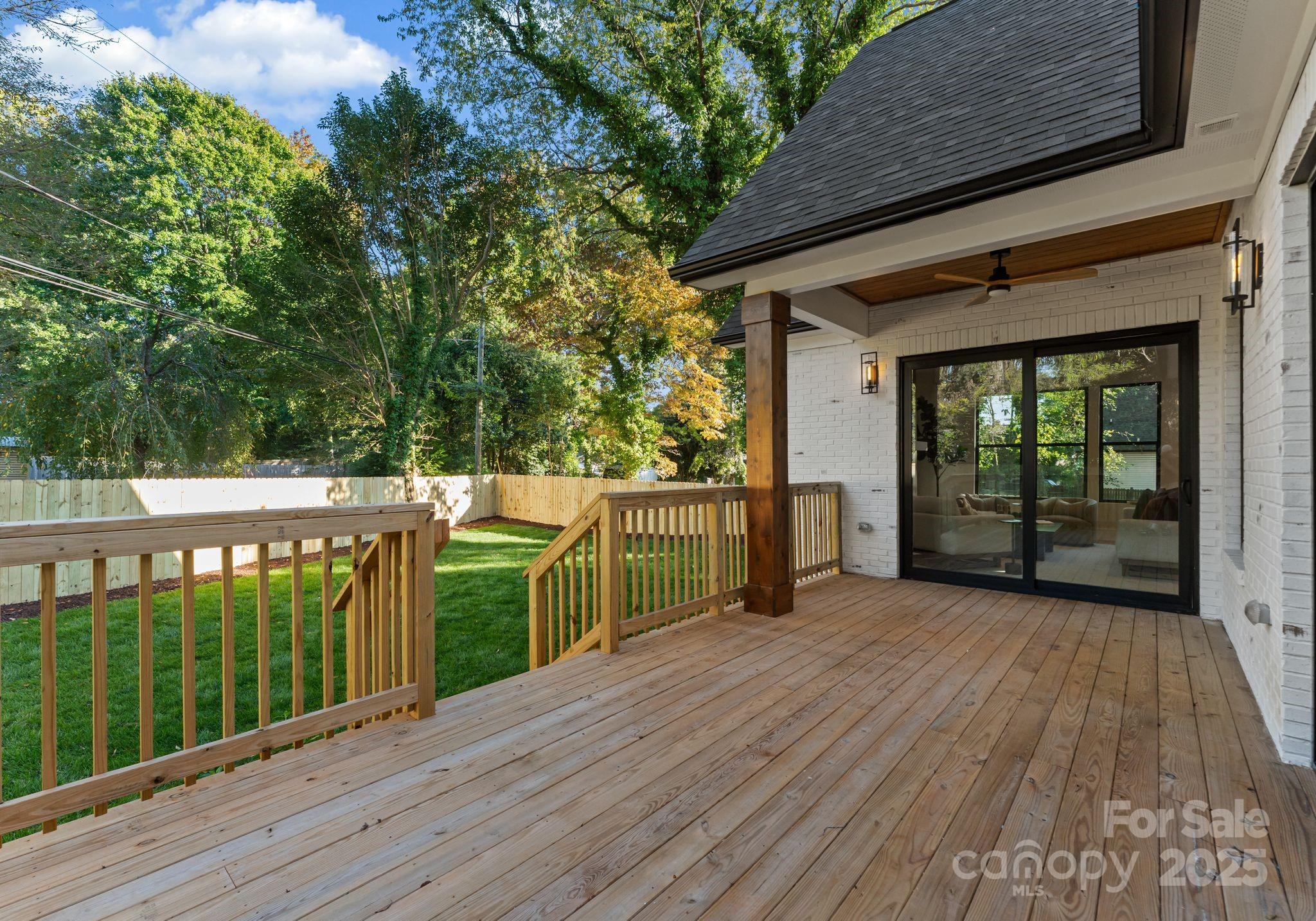 4641 Connecting Road Charlotte, NC 28209 - Photo 45 of 48 a view of a deck with wooden floor and fence