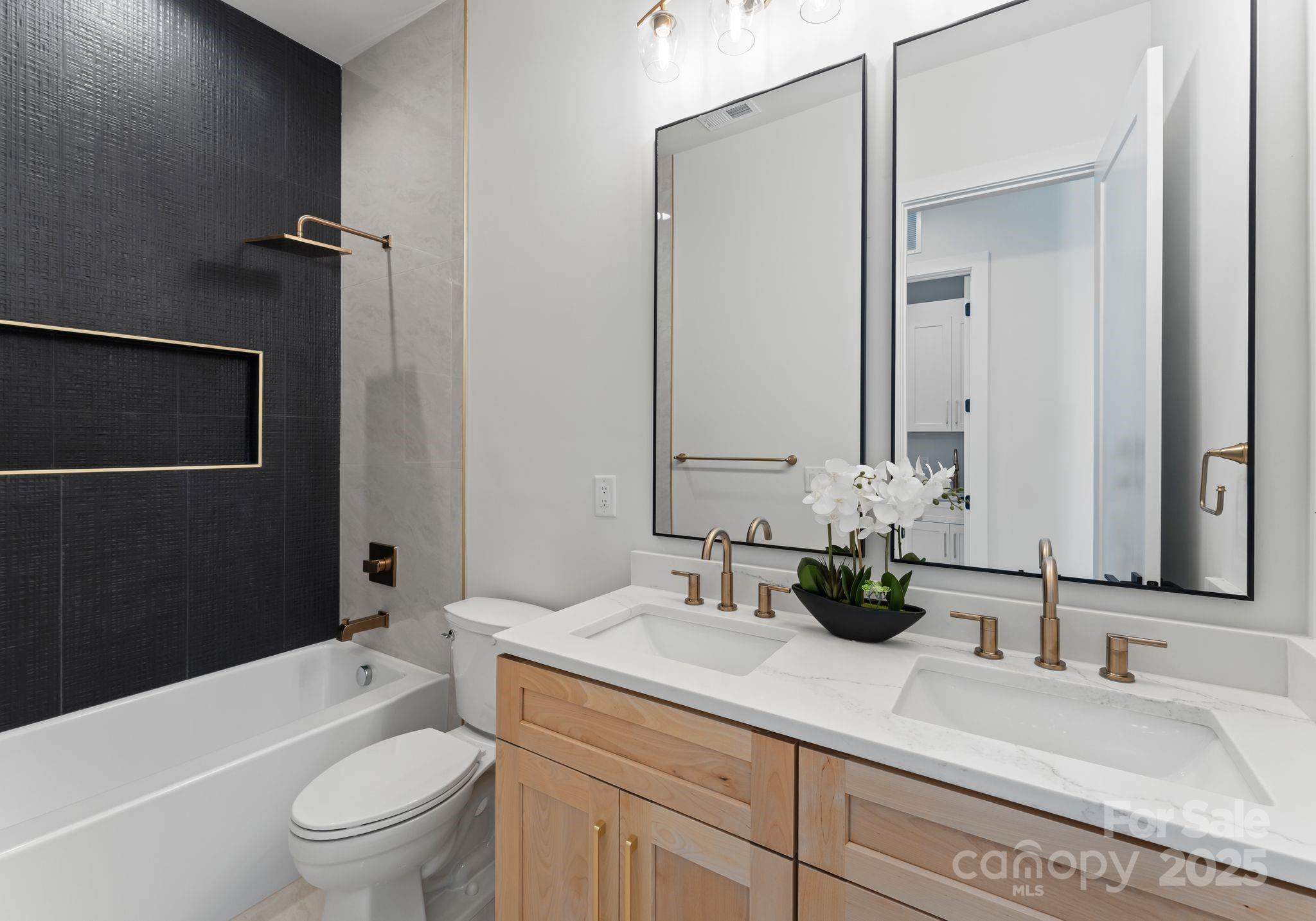 4641 Connecting Road Charlotte, NC 28209 - Photo 10 of 48 a bathroom with a granite countertop sink toilet and shower