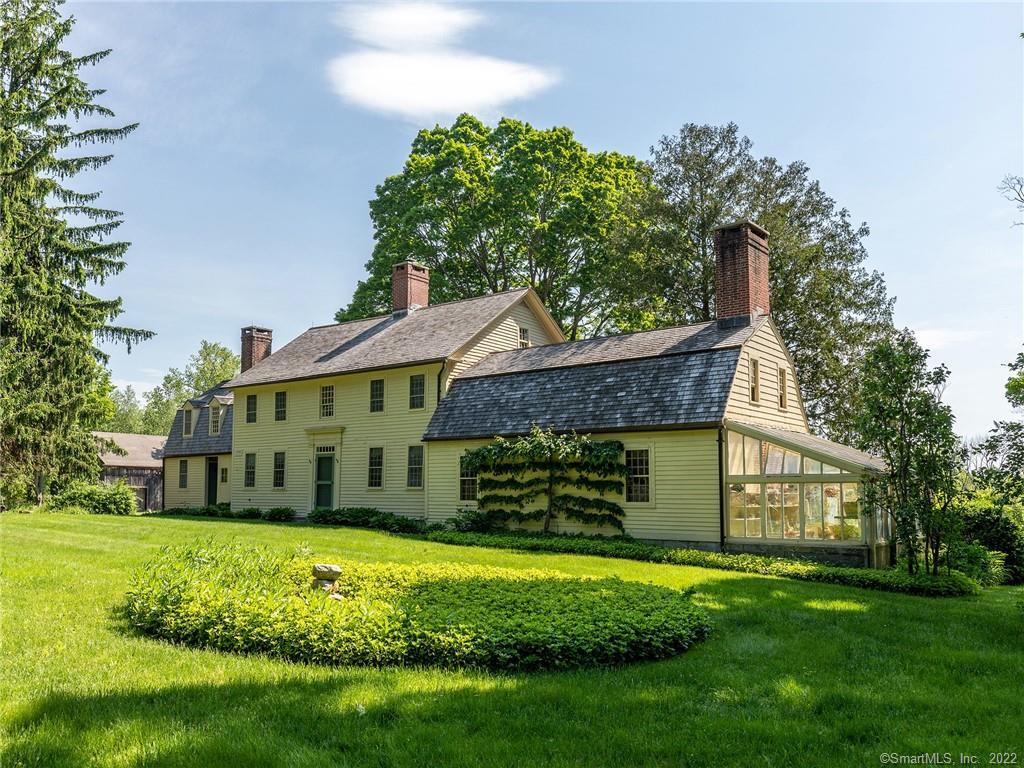 219 Chestnut Hill Road Litchfield, CT 06759 - Photo 1 of 1 a view of a house with a garden