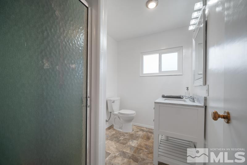 360 Sunset Drive Reno, NV 89509 - Photo 13 of 22 a bathroom with a sink a toilet and shower