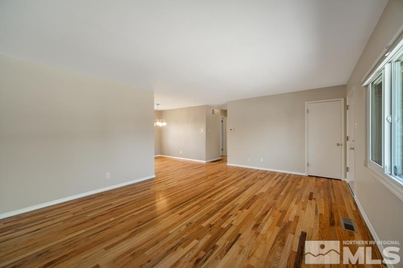 360 Sunset Drive Reno, NV 89509 - Photo 3 of 22 a view of empty room with wooden floor
