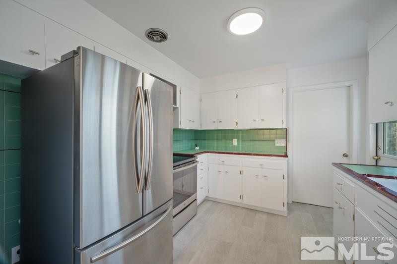 360 Sunset Drive Reno, NV 89509 - Photo 6 of 22 a kitchen with stainless steel appliances a refrigerator and a stove