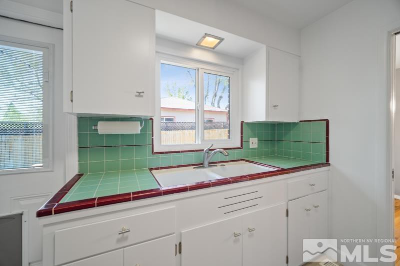 360 Sunset Drive Reno, NV 89509 - Photo 8 of 22 a kitchen with a sink and cabinets