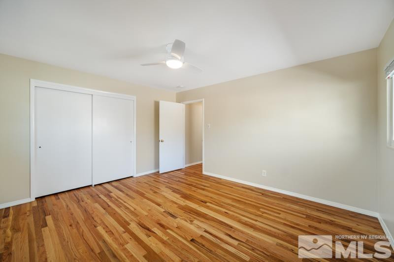 360 Sunset Drive Reno, NV 89509 - Photo 9 of 22 a view of empty room with wooden floor