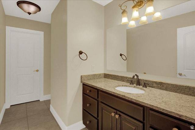 667 Hardscrabble Road Morgan, UT 84050 - Photo 33 of 51 South Upstairs Bedroom Bathroom with vanity, light tile patterned floors, and suspended lighting