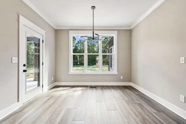 a view of room window and wooden floor