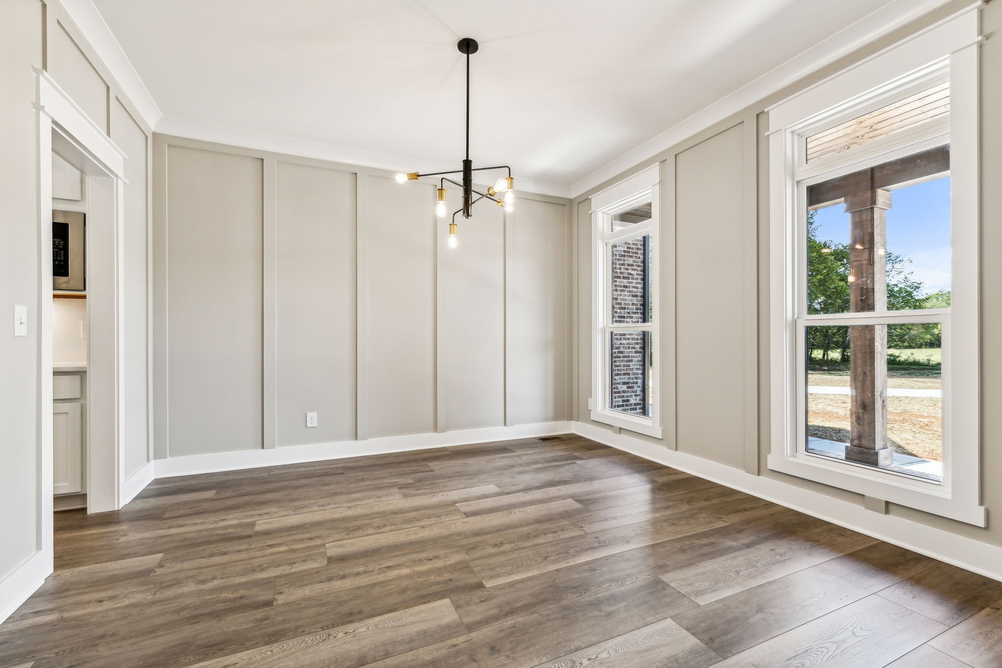 8625 Twelve Corners Road Lascassas, TN 37085 - Photo 12 of 25 a view of an empty room with wooden floor and a window