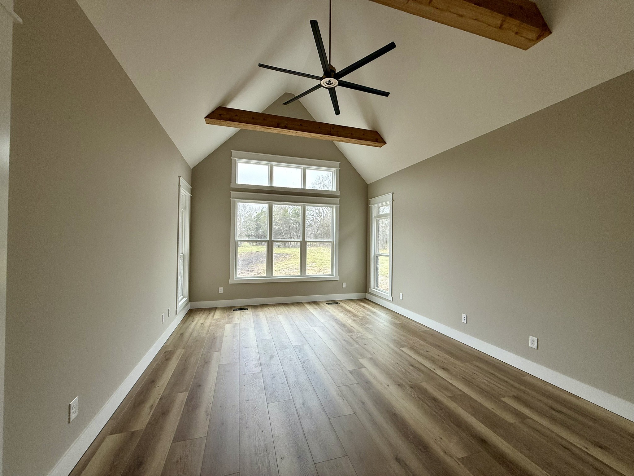 8625 Twelve Corners Road Lascassas, TN 37085 - Photo 13 of 25 a view of empty room with wooden floor and fan