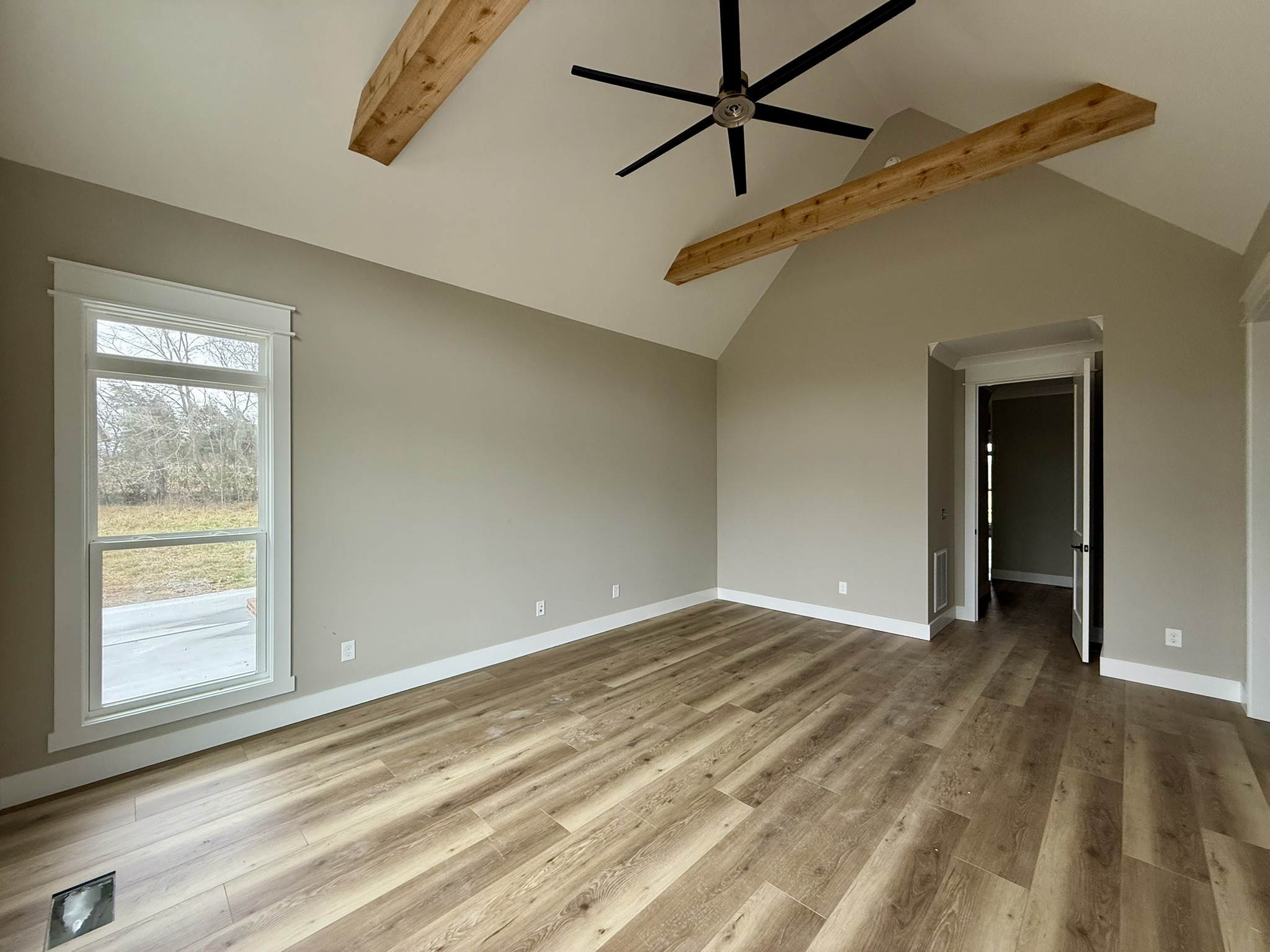 8625 Twelve Corners Road Lascassas, TN 37085 - Photo 14 of 25 a view of a big room with wooden floor and windows