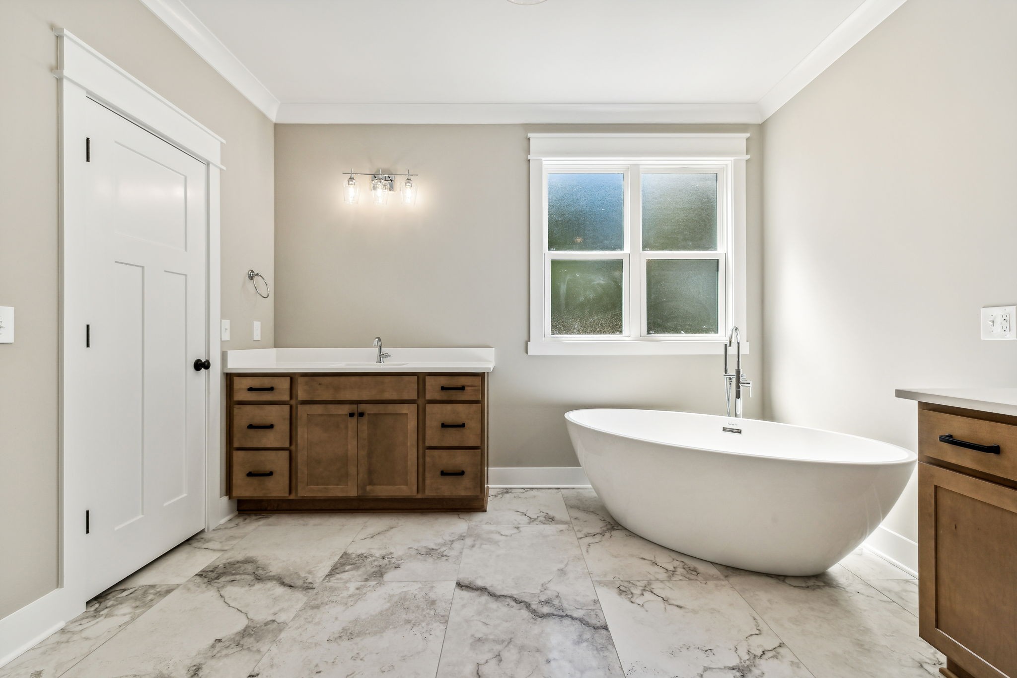 8625 Twelve Corners Road Lascassas, TN 37085 - Photo 17 of 25 a spacious bathroom with a tub sink and mirror