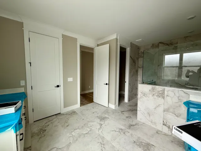 a view of kitchen with stainless steel appliances wooden cabinets and a sink