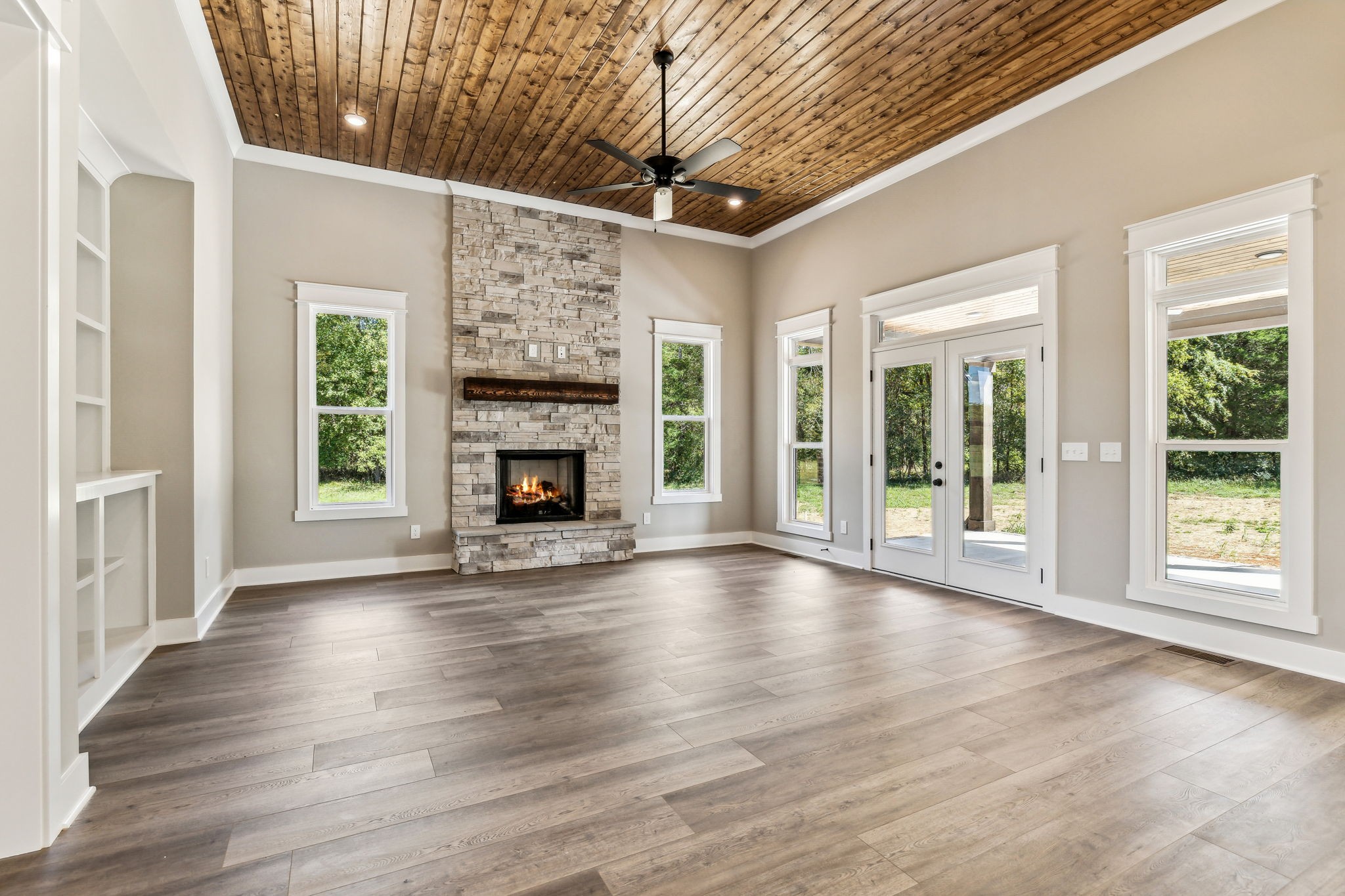 8625 Twelve Corners Road Lascassas, TN 37085 - Photo 4 of 25 a view of an empty room with wooden floor fireplace and a window