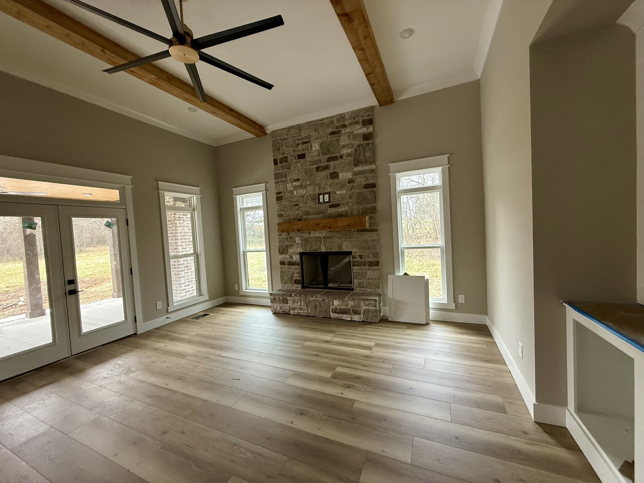 8625 Twelve Corners Road Lascassas, TN 37085 - Photo 5 of 25 a view of an empty room with wooden floor and a window