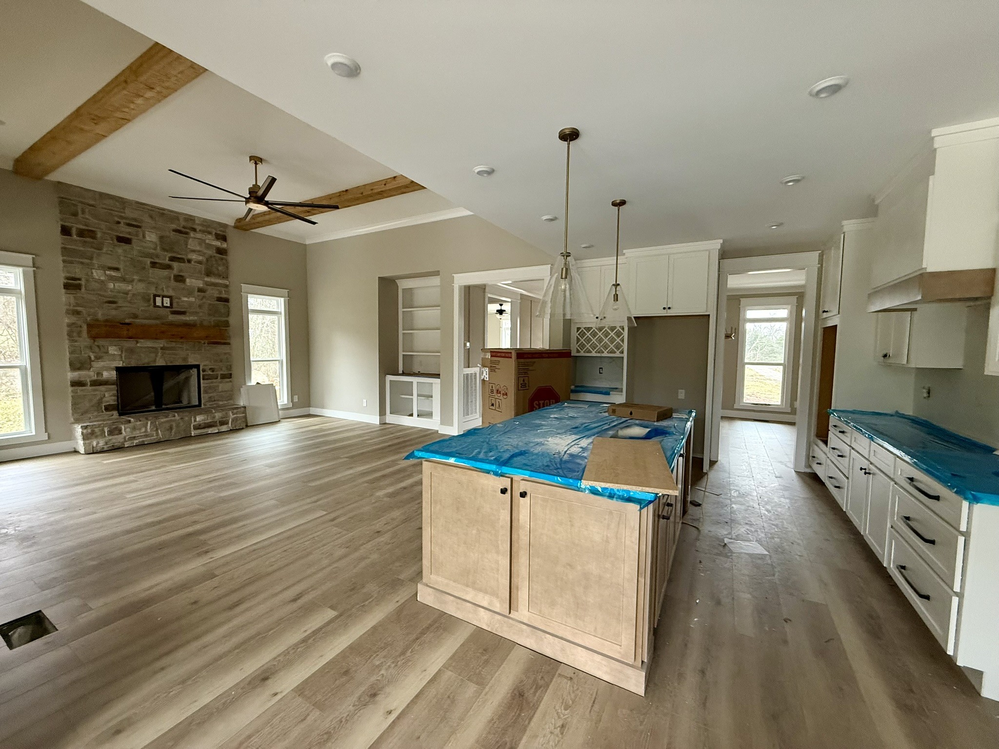 8625 Twelve Corners Road Lascassas, TN 37085 - Photo 7 of 25 a kitchen with kitchen island a stove a sink and a fireplace