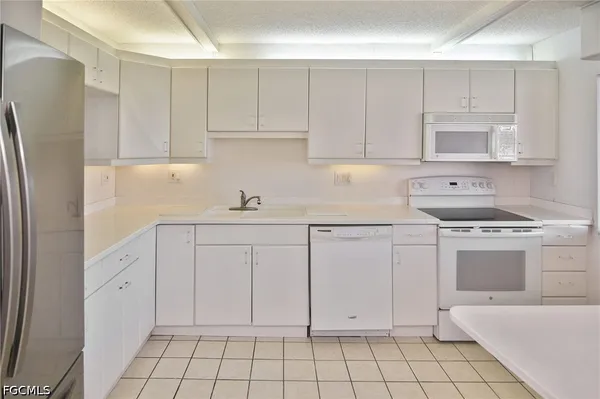 a bathroom with a sink and cabinets
