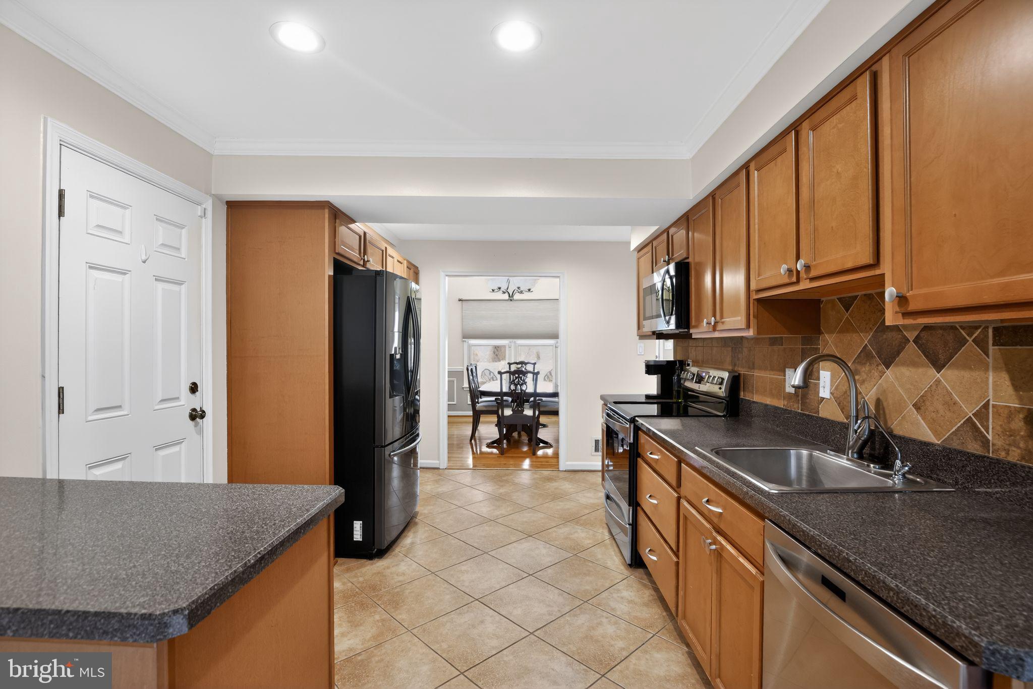 8021 Clark Station Road Severn, MD 21144 - Photo 7 of 36 Modern kitchen with sleek finishes.