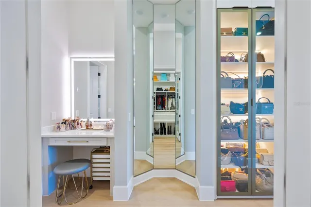 a bathroom with a double vanity sink mirror and bathtub