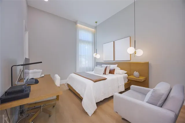 a living room with fireplace furniture and a wooden floor