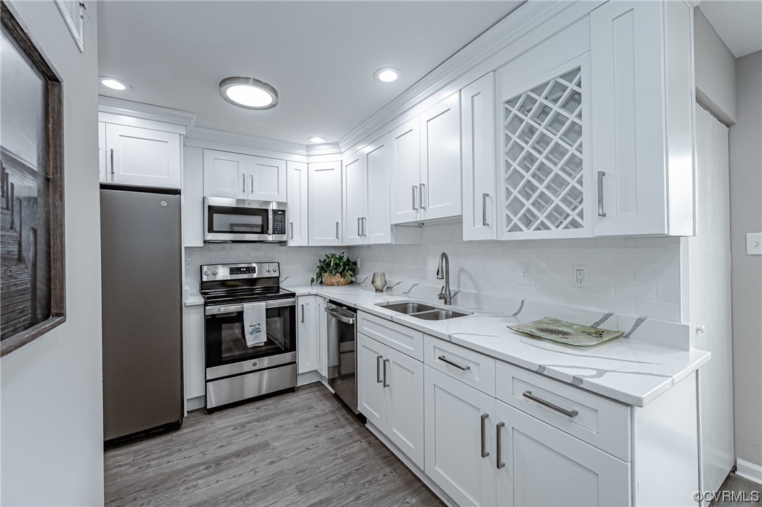 4629 Coldstream Drive Richmond, VA 23234 - Photo 14 of 36 a kitchen with stainless steel appliances granite countertop a refrigerator sink and stove