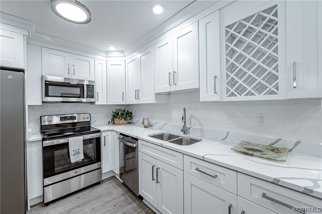 4629 Coldstream Drive Richmond, VA 23234 - Photo 15 of 36 a kitchen with stainless steel appliances granite countertop a sink and a stove