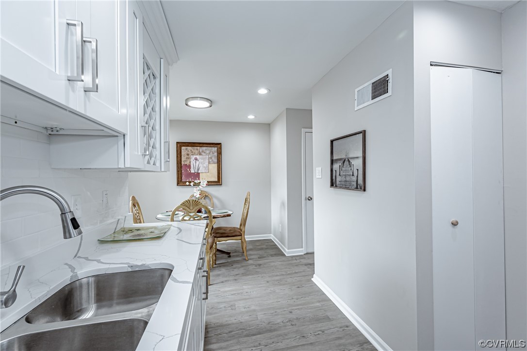 4629 Coldstream Drive Richmond, VA 23234 - Photo 17 of 36 a kitchen with a sink cabinets and wooden floor