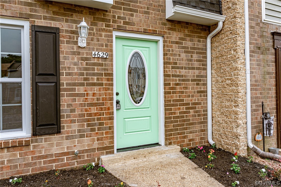 4629 Coldstream Drive Richmond, VA 23234 - Photo 2 of 36 a front view of a house with a door