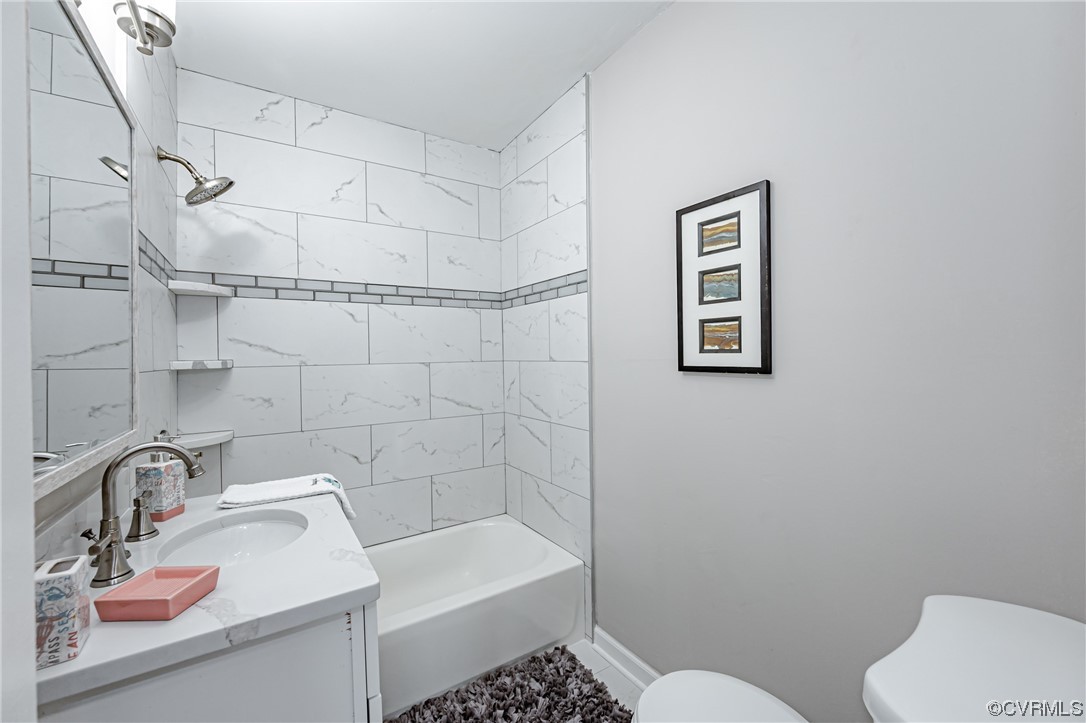 4629 Coldstream Drive Richmond, VA 23234 - Photo 23 of 36 a bathroom with a sink a toilet and shower