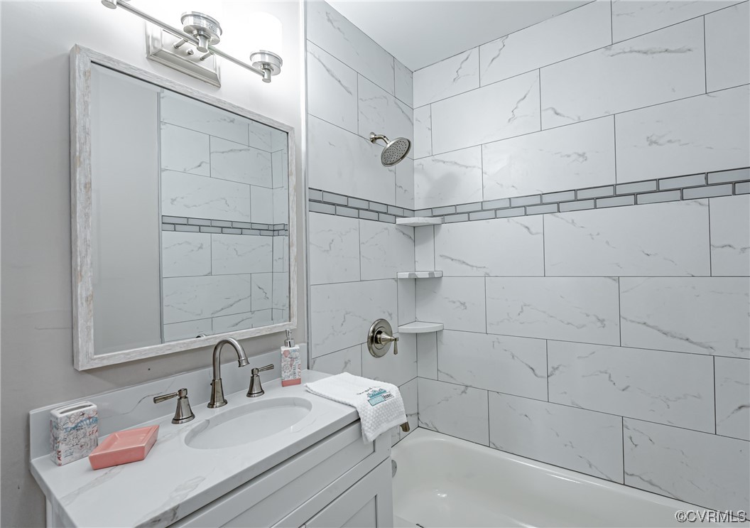 4629 Coldstream Drive Richmond, VA 23234 - Photo 24 of 36 a bathroom with a sink vanity granite and shower