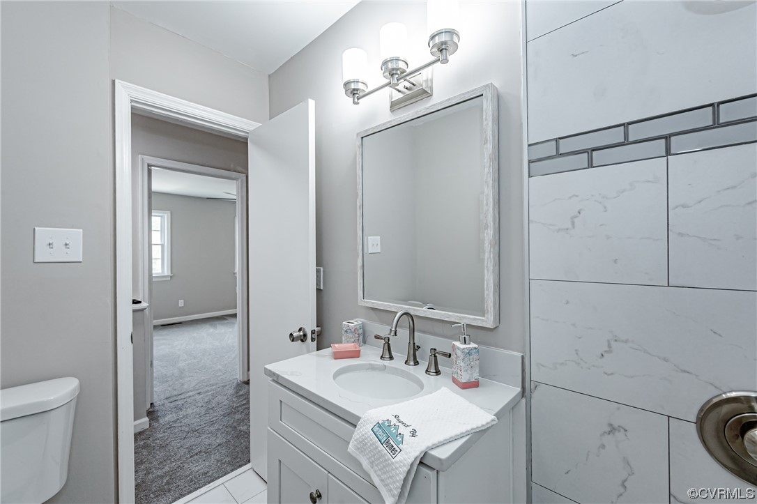 4629 Coldstream Drive Richmond, VA 23234 - Photo 25 of 36 a bathroom with a sink toilet and shower