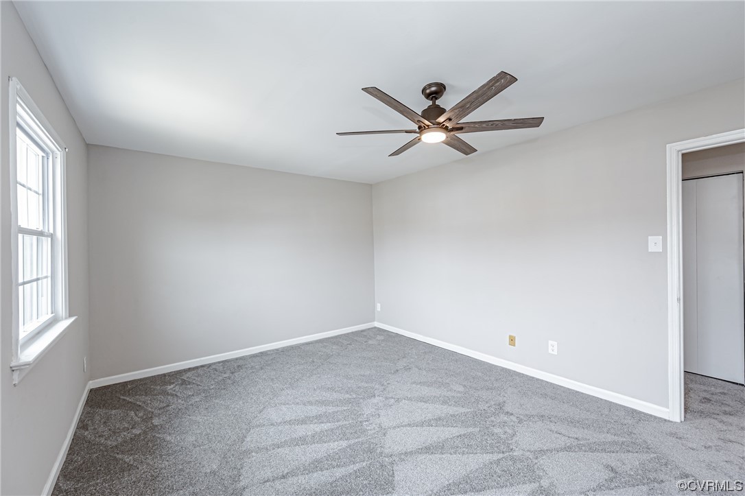 4629 Coldstream Drive Richmond, VA 23234 - Photo 30 of 36 an empty room with a window and a fan