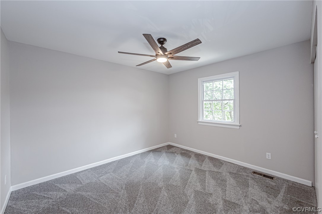 4629 Coldstream Drive Richmond, VA 23234 - Photo 31 of 36 an empty room with a window and a fan