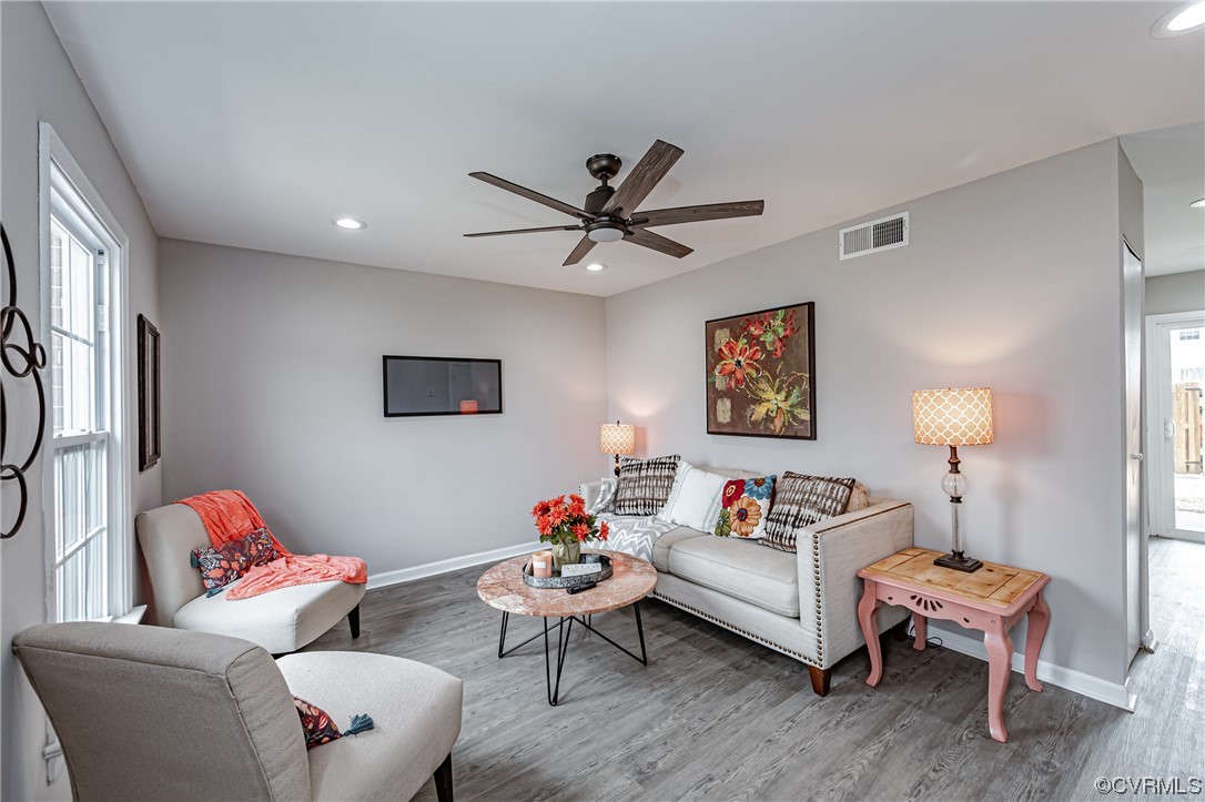 4629 Coldstream Drive Richmond, VA 23234 - Photo 4 of 36 a living room with furniture a rug and a ceiling fan