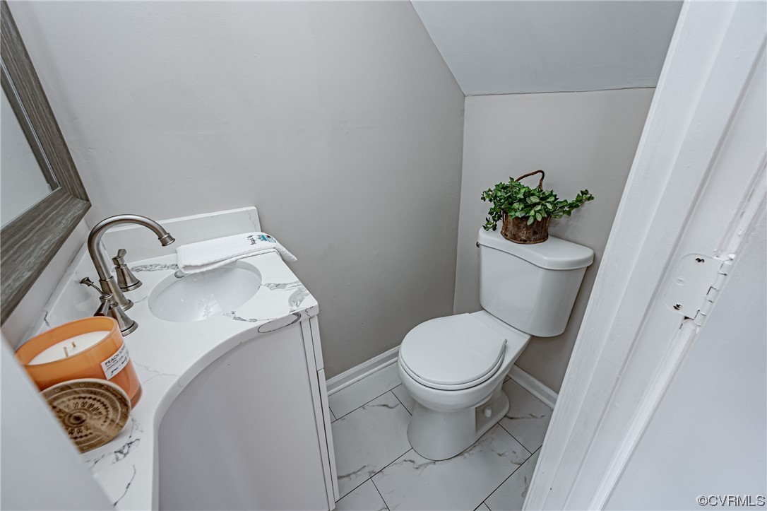 4629 Coldstream Drive Richmond, VA 23234 - Photo 9 of 36 a bathroom with a toilet and a sink