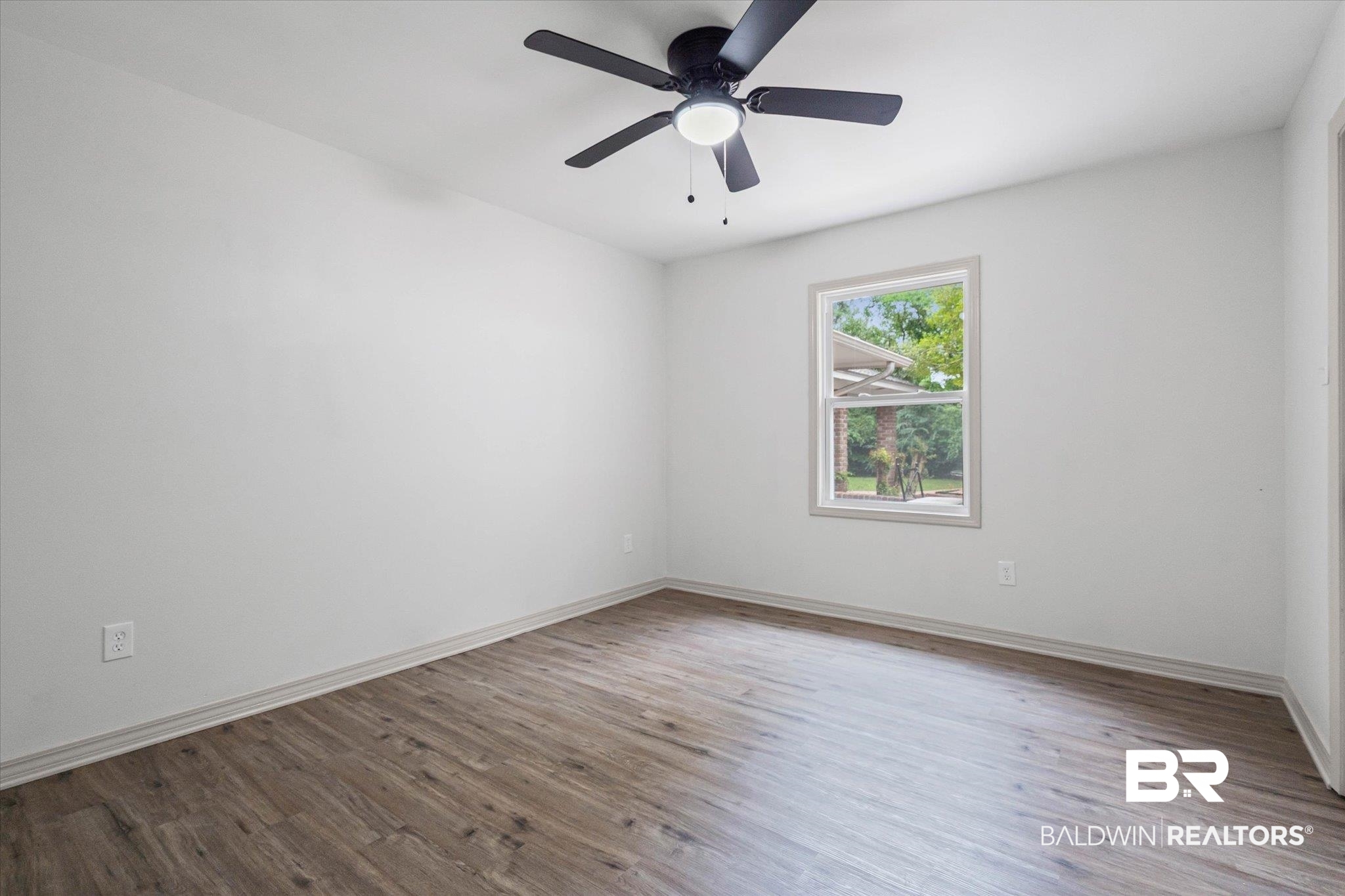 3655 Claridge Road South Mobile, AL 36608 - Photo 25 of 32 Empty room with light wood finished floors and a ceiling fan