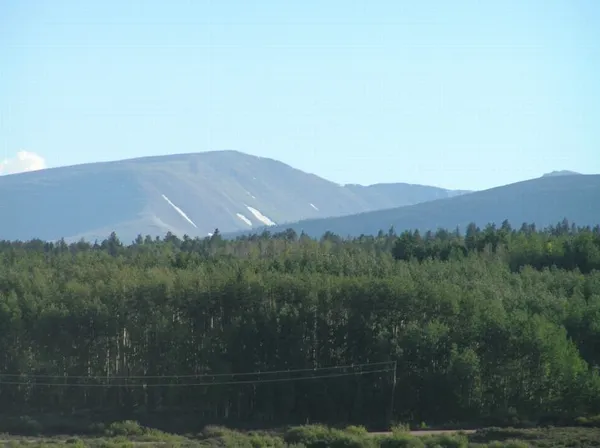 a view of a town with mountains in the background