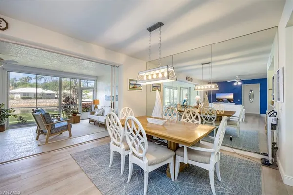 a view of a dining room with furniture window and outside view