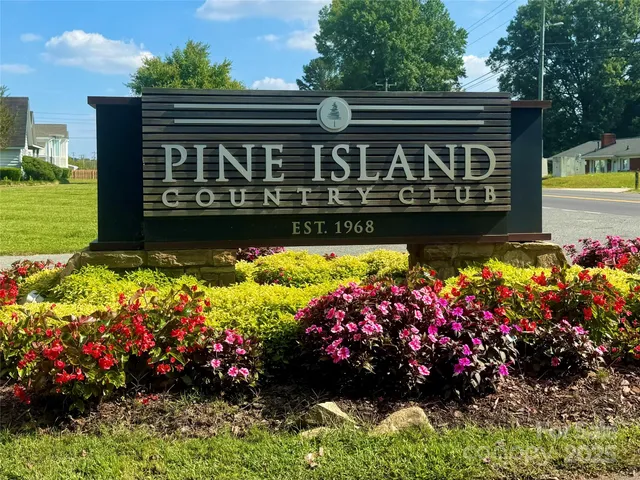 a view of sign board with flowers
