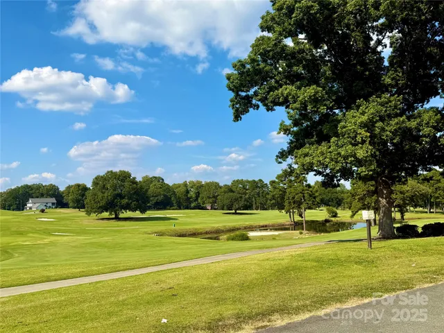 a view of swimming pool is middle and garden