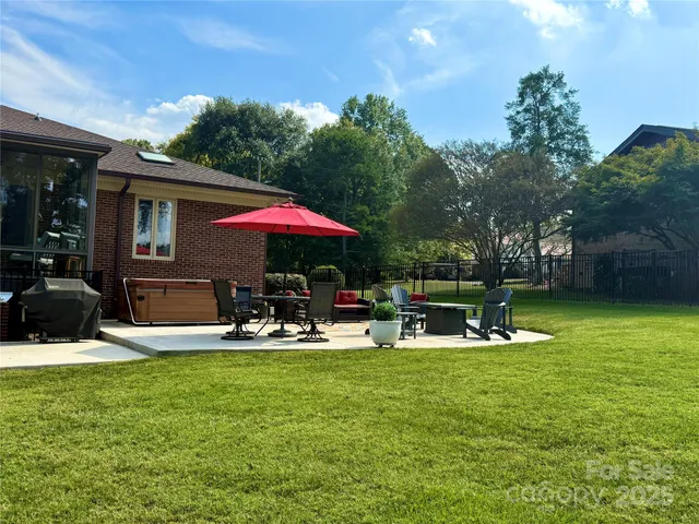 a view of a house with backyard porch and sitting area