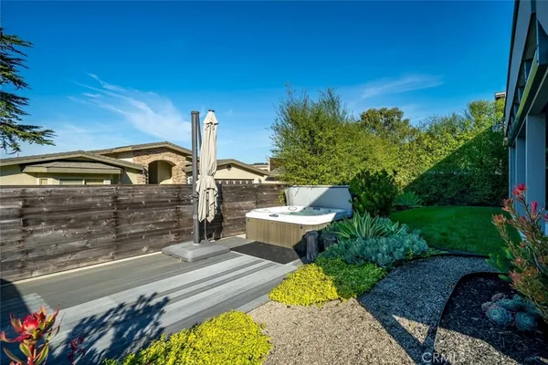 a living room with furniture and a dining table
