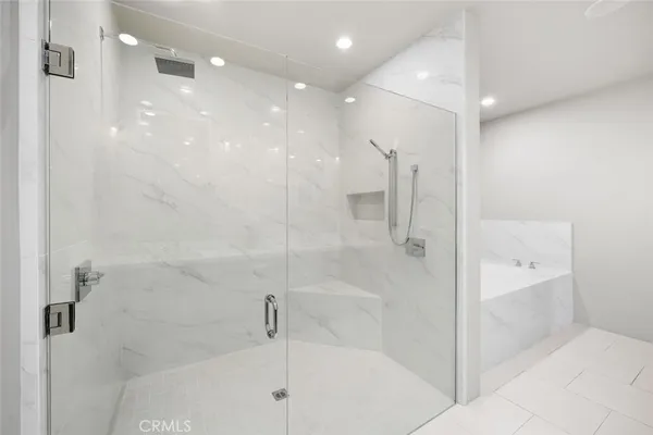 a view of a hallway with washer and dryer