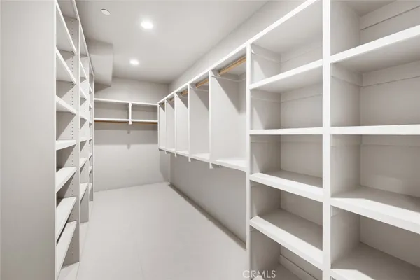 a view of empty room with windows and ceiling fan