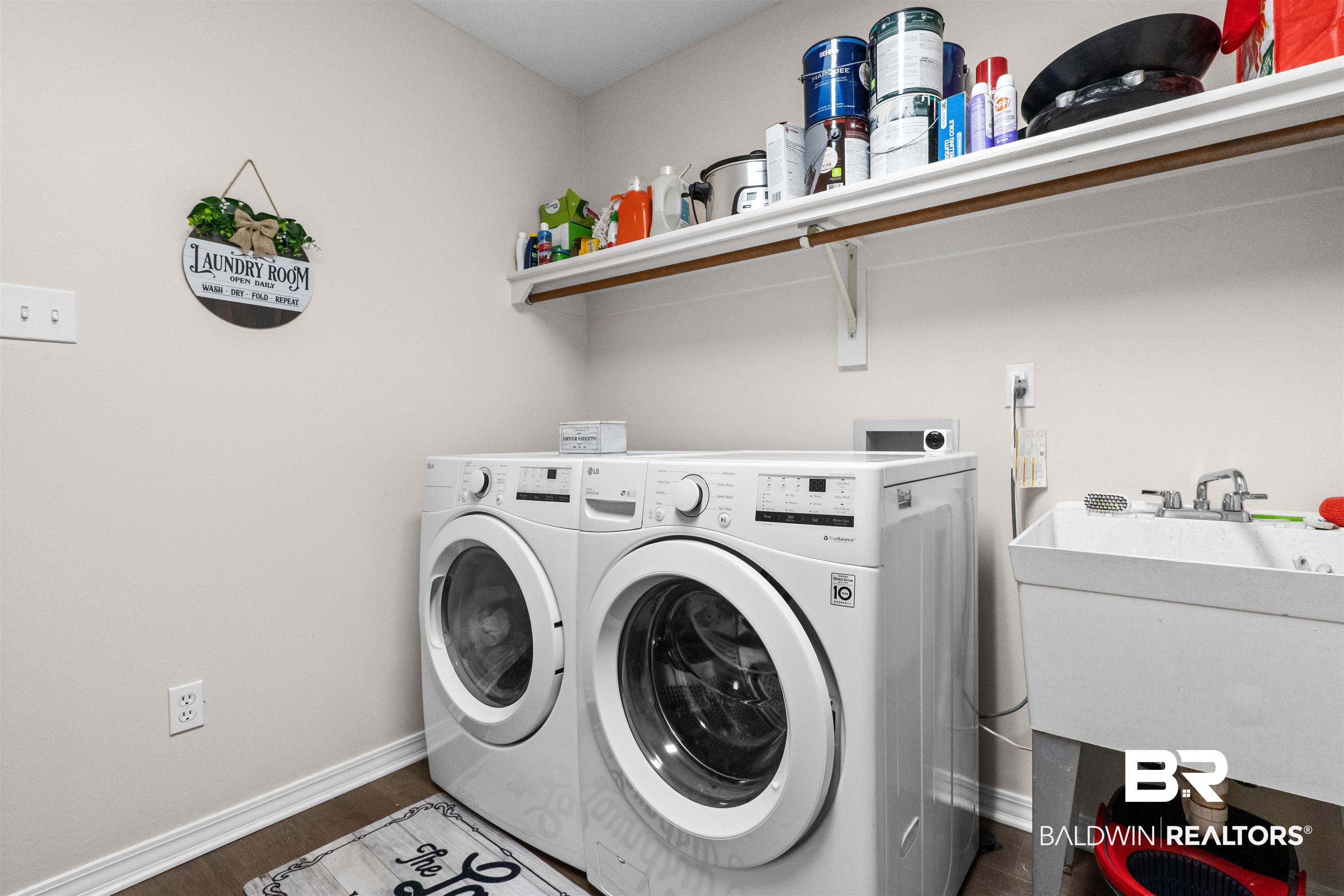 153 Lakeview Loop Daphne, AL 36526 - Photo 27 of 56 Conveniently located and thoughtfully designed, this dedicated laundry room helps keep everyday chores organized and out of sight.