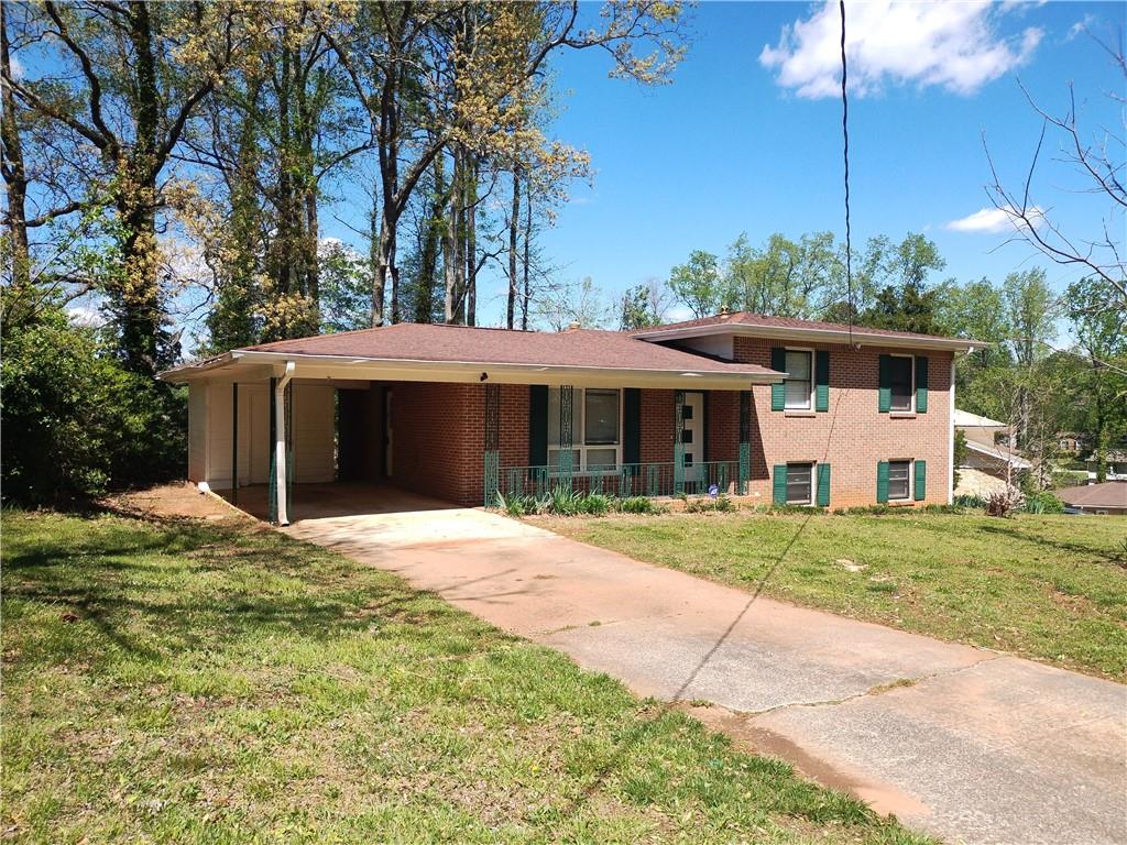 4046 Greenstone Court Decatur, GA 30035 - Photo 1 of 1 a front view of a house with a yard and garage