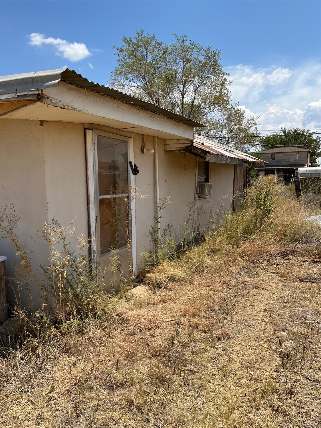 610 Ralls Road Post, TX 79356 - Photo 6 of 9 a backyard of a house with lots of green space