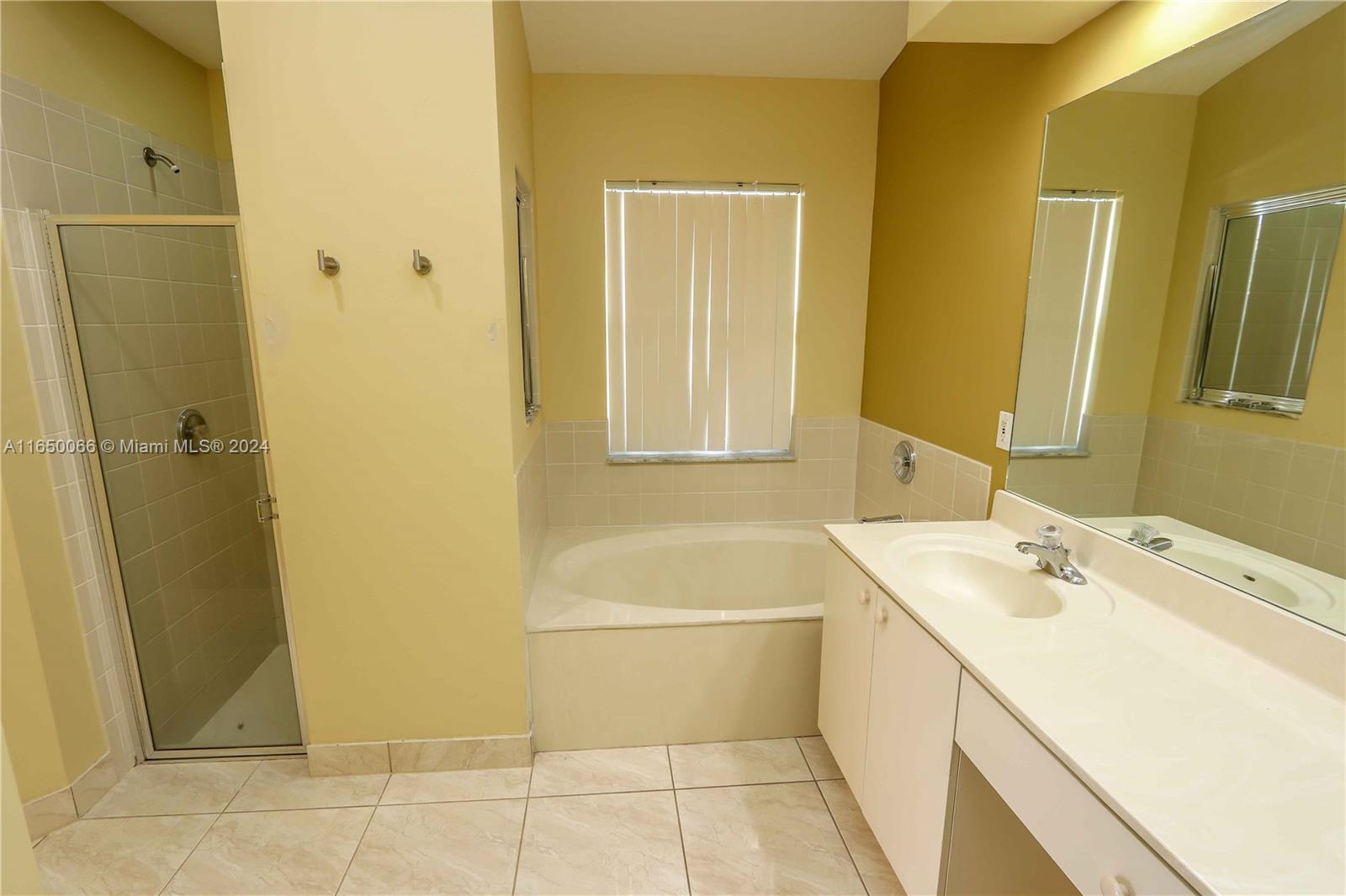 23935 Southwest 108th Place Homestead, FL 33032 - Photo 13 of 30 a bathroom with a sink a toilet and shower