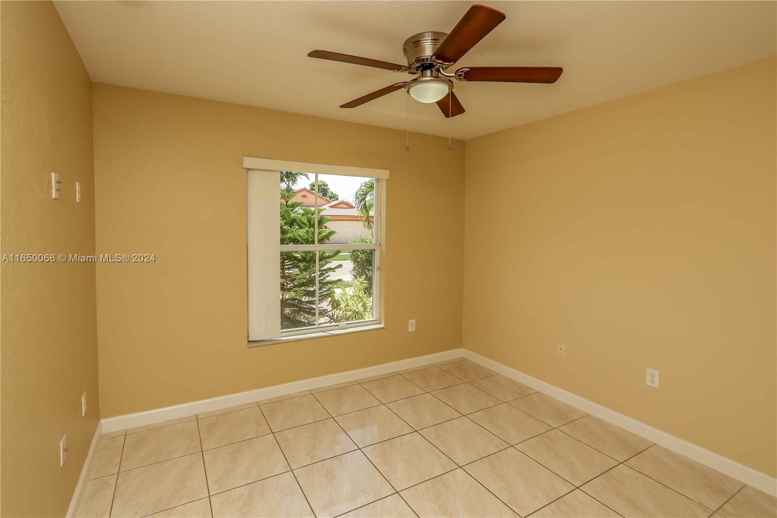 23935 Southwest 108th Place Homestead, FL 33032 - Photo 17 of 30 a view of an empty room and a window