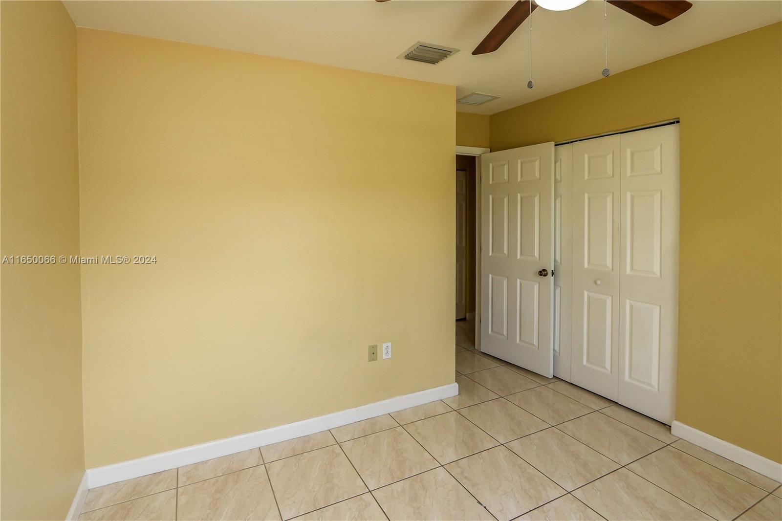 23935 Southwest 108th Place Homestead, FL 33032 - Photo 18 of 30 a view of an empty room