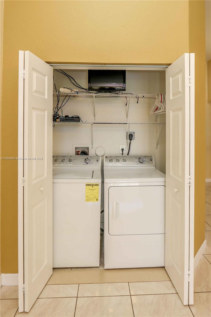 23935 Southwest 108th Place Homestead, FL 33032 - Photo 21 of 30 a utility room with dryer and washer